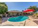 Inviting backyard pool surrounded by lounging space, perfect for outdoor enjoyment and entertaining at 1426 E Indigo Cir, Mesa, AZ 85203