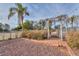 Beautiful backyard with mature trees, rock, and a landscaped area at 15076 W Belmont Dr, Casa Grande, AZ 85194