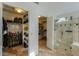 Walk-in closet features custom shelving and storage space in addition to a walk in shower at 15076 W Belmont Dr, Casa Grande, AZ 85194