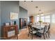 Inviting dining room with a large table, decorative furnishings, and bright natural light at 15076 W Belmont Dr, Casa Grande, AZ 85194