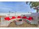 Inviting outdoor fire pit with built-in seating, perfect for entertaining guests at 15076 W Belmont Dr, Casa Grande, AZ 85194