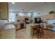 Bright, open kitchen with modern appliances, an island, and ample counter space at 15076 W Belmont Dr, Casa Grande, AZ 85194
