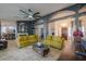 Bright living room with a cozy fireplace, modern decor, and an open floor plan at 15076 W Belmont Dr, Casa Grande, AZ 85194
