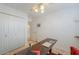 Office space with a dark desk and closet with paneled doors at 15076 W Belmont Dr, Casa Grande, AZ 85194