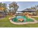 Backyard pool with rock accents and stone landscaping at 15076 W Belmont Dr, Casa Grande, AZ 85194