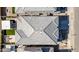 Birds eye view of house showing roof, outdoor living, and landscaped backyard with patio and fireplace at 1957 W Lonesome Trl, Phoenix, AZ 85085