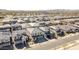 Aerial view of a residential neighborhood with uniform homes and well-maintained streets, showing community density at 1957 W Lonesome Trl, Phoenix, AZ 85085