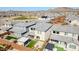 Aerial view of the property showing the backyard, including an outdoor kitchen, fire pit, and artificial grass at 1957 W Lonesome Trl, Phoenix, AZ 85085
