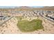 Aerial view of a community with a central green space and surrounding homes, showcasing the neighborhood's layout at 1957 W Lonesome Trl, Phoenix, AZ 85085