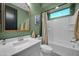 Well-lit bathroom features a shower-tub combo, modern vanity, and a stylish mirror for a luxurious experience at 1957 W Lonesome Trl, Phoenix, AZ 85085