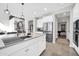 Modern kitchen with stainless steel appliances, white cabinets, and a large island at 1957 W Lonesome Trl, Phoenix, AZ 85085