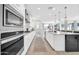 Modern kitchen features white cabinets and stainless appliances at 1957 W Lonesome Trl, Phoenix, AZ 85085