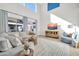 Bright living room with high ceilings, large windows and comfortable seating and media center at 1957 W Lonesome Trl, Phoenix, AZ 85085