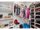 Well-organized walk-in closet with custom shelves and hanging rods for efficient storage at 1957 W Lonesome Trl, Phoenix, AZ 85085