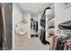 Spacious walk-in closet with custom shelving and ample storage for clothing, shoes, and accessories at 1957 W Lonesome Trl, Phoenix, AZ 85085