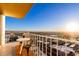 Enjoy breathtaking sunrise views from this condo balcony with table and chairs at 207 W Clarendon Ave # B22, Phoenix, AZ 85013