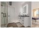 Bathroom showcasing a vanity with an illuminated mirror and stylish fixtures at 207 W Clarendon Ave # B22, Phoenix, AZ 85013