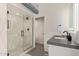 Contemporary bathroom featuring a glass-enclosed shower and a sleek vanity at 207 W Clarendon Ave # B22, Phoenix, AZ 85013