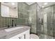 Modern bathroom with a tiled shower, stylish vanity, and sleek fixtures at 207 W Clarendon Ave # B22, Phoenix, AZ 85013