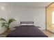 A modern bedroom featuring a minimalist design and ample natural light at 207 W Clarendon Ave # B22, Phoenix, AZ 85013