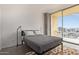 Bright bedroom with large sliding glass doors to balcony offering expansive city views at 207 W Clarendon Ave # B22, Phoenix, AZ 85013