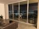 Stunning nighttime city views from the living room and balcony at 207 W Clarendon Ave # B22, Phoenix, AZ 85013