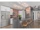 Modern kitchen featuring stainless steel appliances, a brick backsplash, and seating at the island at 207 W Clarendon Ave # B22, Phoenix, AZ 85013