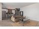Spacious living room with an open layout, adjacent to a modern kitchen and dining area at 207 W Clarendon Ave # B22, Phoenix, AZ 85013