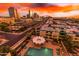 The sparkling pool is surrounded by trees and landscaping at 207 W Clarendon Ave # B22, Phoenix, AZ 85013