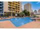 Inviting pool area with lounge chairs offering a relaxing outdoor oasis for residents at 207 W Clarendon Ave # B22, Phoenix, AZ 85013