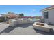 Backyard with fire pit, outdoor kitchen, and covered lounge near a pool at 22805 W Hopi St, Buckeye, AZ 85326