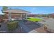 Inviting backyard with a gazebo, lush landscaping, and an in-ground pool for relaxing outdoor living at 22805 W Hopi St, Buckeye, AZ 85326