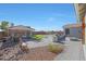 Spacious backyard with pool, patio, fire pit, and outdoor kitchen for entertainment at 22805 W Hopi St, Buckeye, AZ 85326