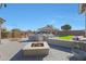 Open backyard features a fire pit, outdoor kitchen, patio, and lounging area at 22805 W Hopi St, Buckeye, AZ 85326