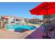 A sparkling in-ground pool surrounded by well-maintained landscaping and lounging areas for ultimate relaxation at 22805 W Hopi St, Buckeye, AZ 85326