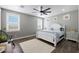 This bedroom features a ceiling fan and two windows at 22805 W Hopi St, Buckeye, AZ 85326