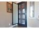 Stylish front door with glass panels and a screen, offering a modern entrance at 22805 W Hopi St, Buckeye, AZ 85326