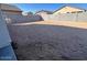 Large, empty lot with block wall perfect for designing your dream backyard at 23252 W Miami St, Buckeye, AZ 85326