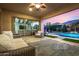 Gorgeous backyard features a sparkling pool, covered patio, and ample seating at 3005 E Valencia Dr, Phoenix, AZ 85042