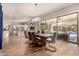 Open dining room with backyard access, a modern chandelier, and tile flooring at 3005 E Valencia Dr, Phoenix, AZ 85042