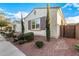 Side view of a single-story stucco home with gravel landscaping and desert shrubbery at 3005 E Valencia Dr, Phoenix, AZ 85042