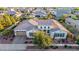 Stunning single-Gathering home featuring a desert landscape, tile roof, and attached three-car garage at 3005 E Valencia Dr, Phoenix, AZ 85042