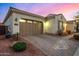 Charming one-story home with desert landscaping, a paver driveway and a two-car garage at 3005 E Valencia Dr, Phoenix, AZ 85042