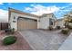 Charming one-story home with desert landscaping, a paver driveway and a two-car garage at 3005 E Valencia Dr, Phoenix, AZ 85042