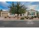 Charming single-story home with desert landscaping, a mature tree and a two-car garage at 3005 E Valencia Dr, Phoenix, AZ 85042