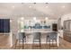 Bright kitchen features a large island with seating, stainless steel appliances and ample cabinet space at 3005 E Valencia Dr, Phoenix, AZ 85042