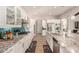 Stylish kitchen featuring white cabinets, granite countertops, and stainless steel appliances at 3005 E Valencia Dr, Phoenix, AZ 85042