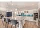 Modern kitchen with white cabinets, granite countertops, an oversized island, and stainless steel appliances at 3005 E Valencia Dr, Phoenix, AZ 85042