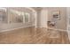 Bright living room with hardwood floors, large windows, and neutral wall color at 3005 E Valencia Dr, Phoenix, AZ 85042