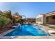 Inviting backyard pool with mature landscaping, pergola, and ample space for outdoor enjoyment at 3005 E Valencia Dr, Phoenix, AZ 85042